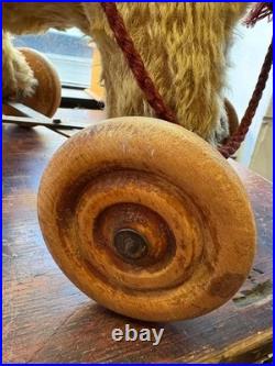 A Glorious Rare Early 20th Century German Mo Hair Bear On Wheels Medium Sized
