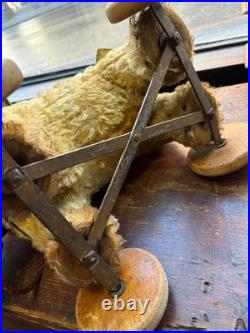 A Glorious Rare Early 20th Century German Mo Hair Bear On Wheels Medium Sized