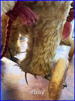 A Glorious Rare Early 20th Century German Mo Hair Bear On Wheels Medium Sized