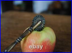 A Super Rare Early Brass Pastry Wheel with Spoon In Good Condition