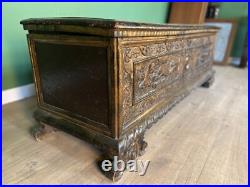 A rare early 17th century walnut gilded Italian Cassone