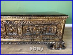 A rare early 17th century walnut gilded Italian Cassone