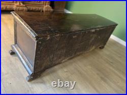 A rare early 17th century walnut gilded Italian Cassone