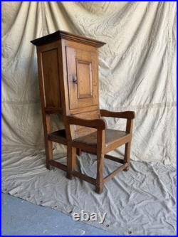 A rare early 19th century antique oak Porter's chair