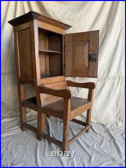 A rare early 19th century antique oak Porter's chair