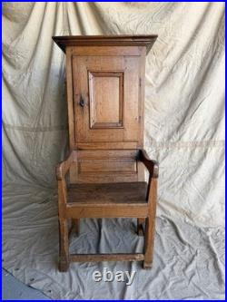 A rare early 19th century antique oak Porter's chair
