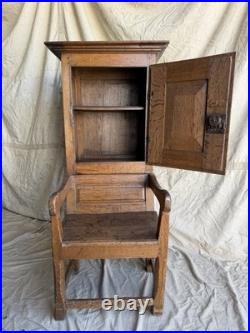 A rare early 19th century antique oak Porter's chair