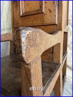 A rare early 19th century antique oak Porter's chair