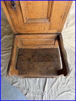 A rare early 19th century antique oak Porter's chair