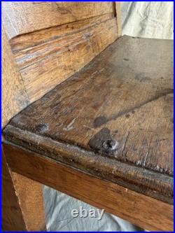 A rare early 19th century antique oak Porter's chair