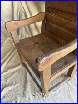 A rare early 19th century antique oak Porter's chair