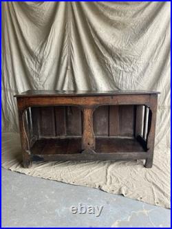 An antique early Georgian North Yorkshire oak dresser base with pot board