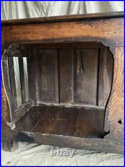 An antique early Georgian North Yorkshire oak dresser base with pot board