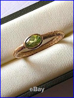 Antique early 19C gold and peridot ring with textured shank. Size N. Rare