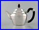 Early_and_rare_Georg_Jensen_teapot_in_hammered_silver_with_handle_in_ebony_01_xw
