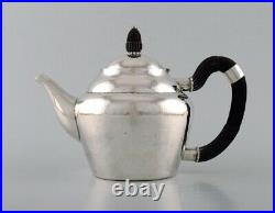Early and rare Georg Jensen teapot in hammered silver with handle in ebony