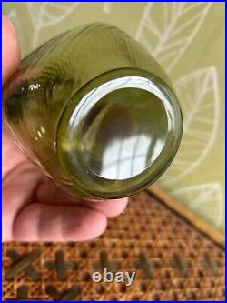 Early blown green glass textured one handled jug, 16cms height, rare item