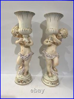 Rare Pair Antique Bisque Porcelain Cherub Angel Holding Urn Candlestick Holders