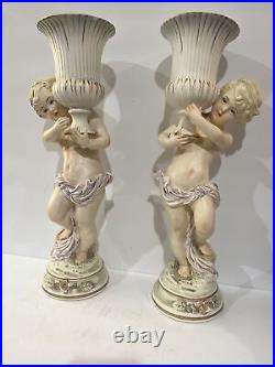 Rare Pair Antique Bisque Porcelain Cherub Angel Holding Urn Candlestick Holders